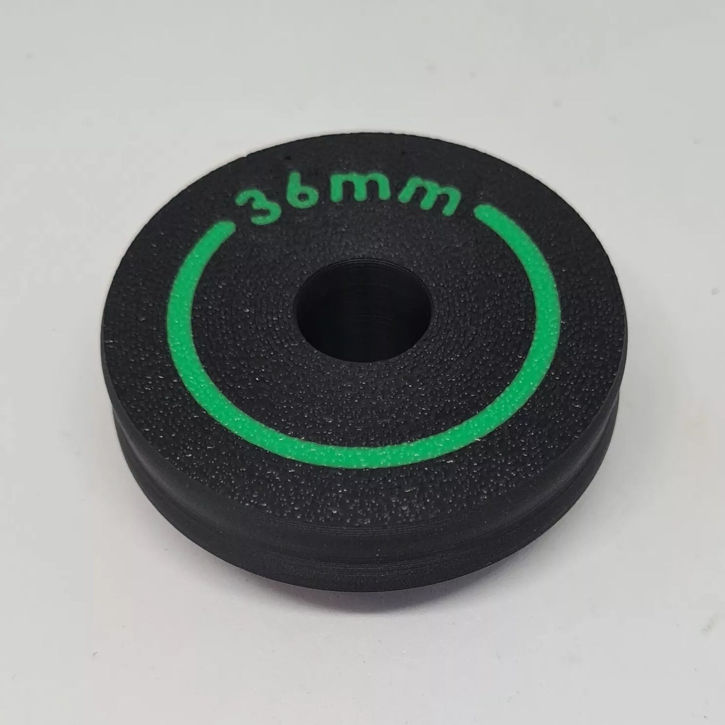 A cylindrical puck sized to press in wiper seals on mountain bike suspension forks
