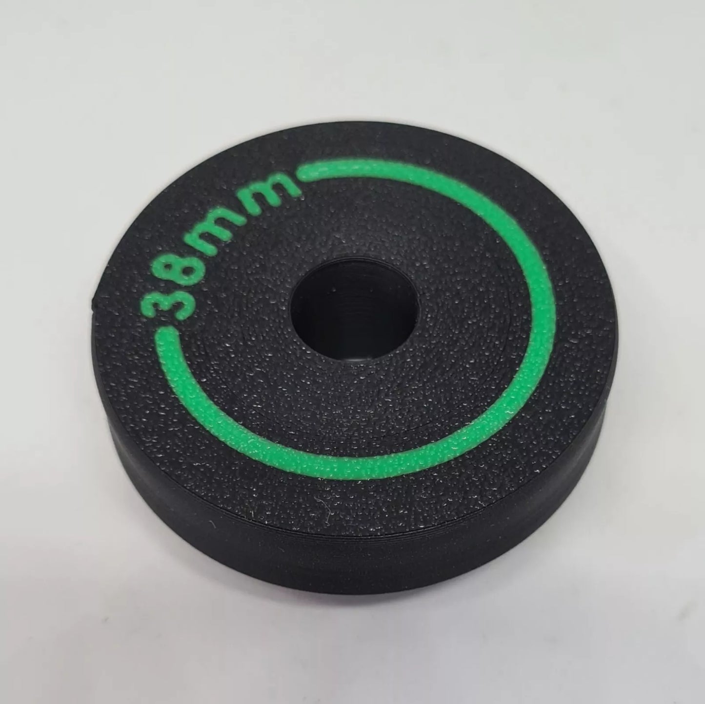 A cylindrical puck sized to press in wiper seals on mountain bike suspension forks