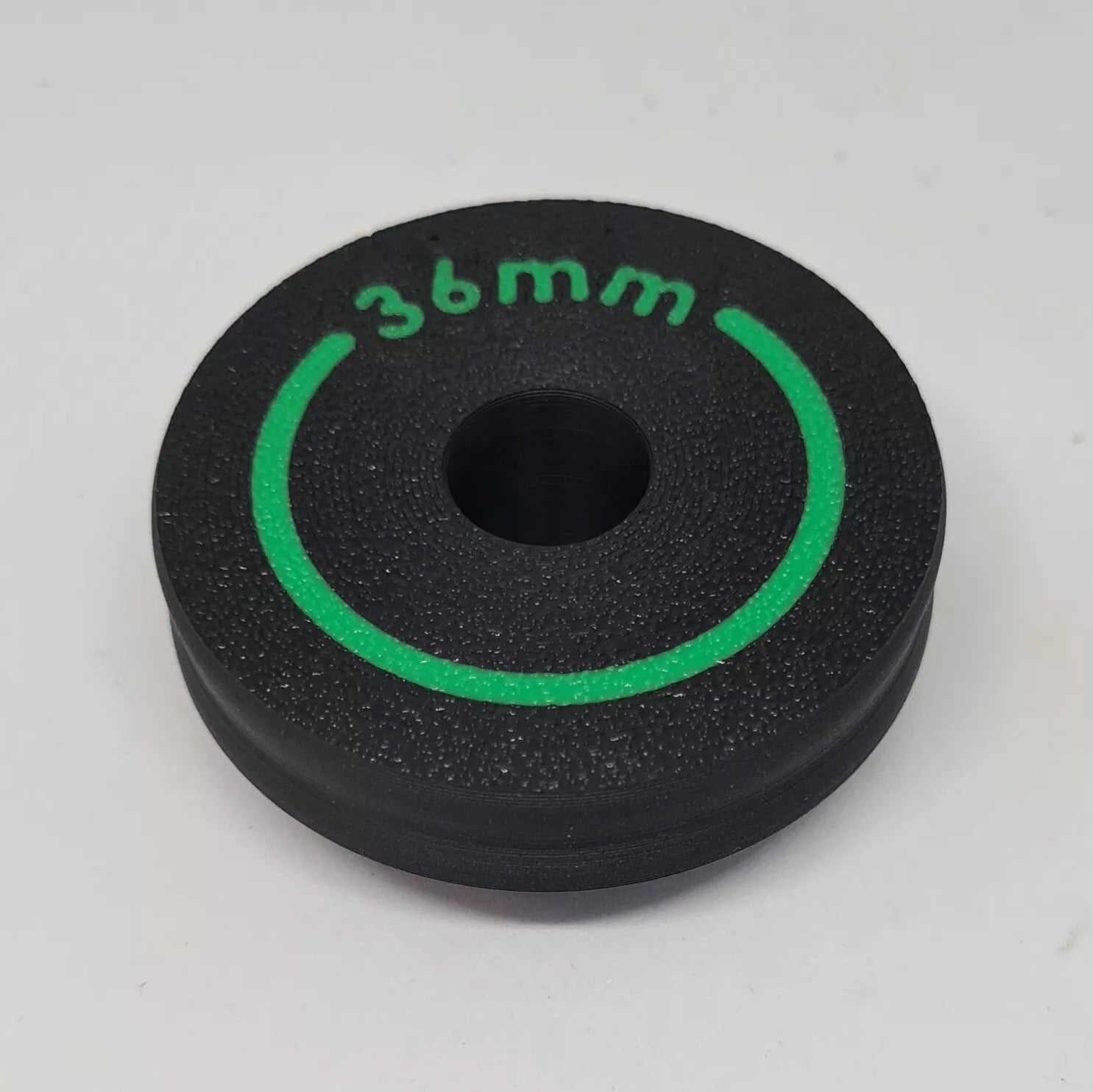 A cylindrical puck sized to press in wiper seals on mountain bike suspension forks 