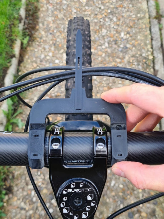 An alignment tool to line up handlebars with the front tyre on a mountain bike 