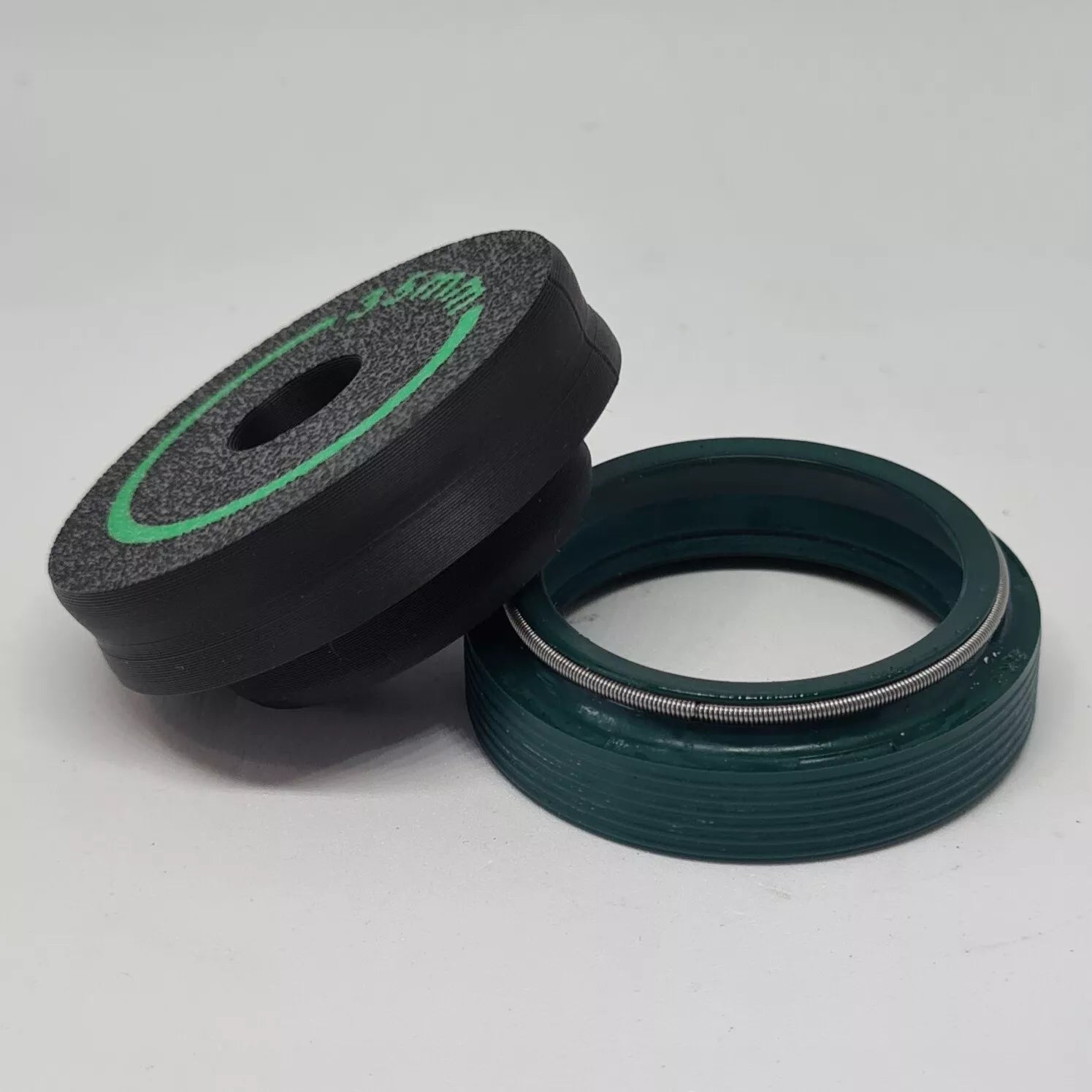 A cylindrical puck sized to press in wiper seals on mountain bike suspension forks 