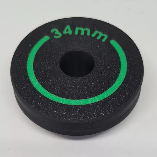 A cylindrical puck sized to press in wiper seals on mountain bike suspension forks 