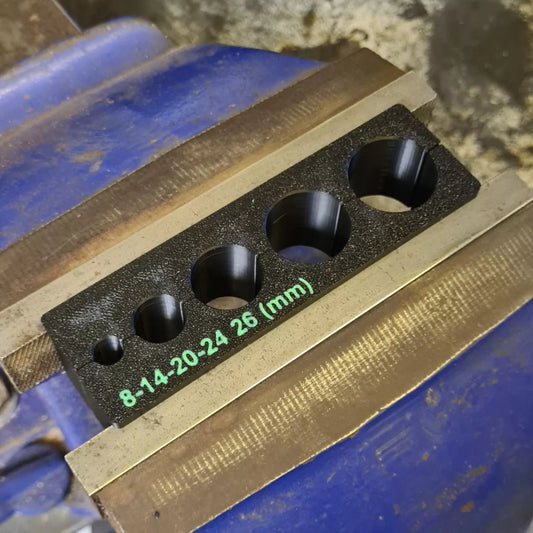 Vice blocks used to grip suspension shafts of specific sizes 